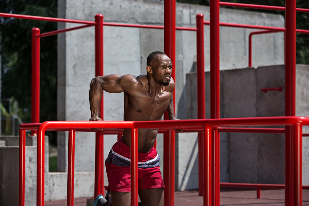 A man works out on the horizontal bar
